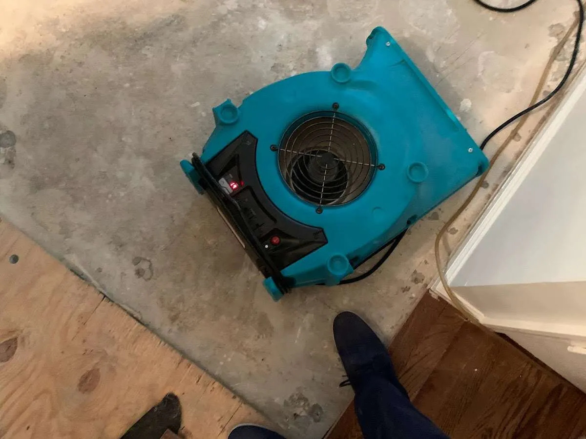 Air mover drying subfloor during Leak Detection & Repair in Mount Joy